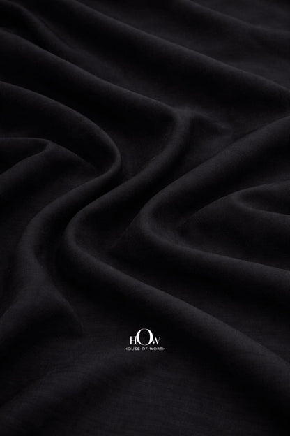High-quality black cotton poplin fabric for tailored garments and dresses