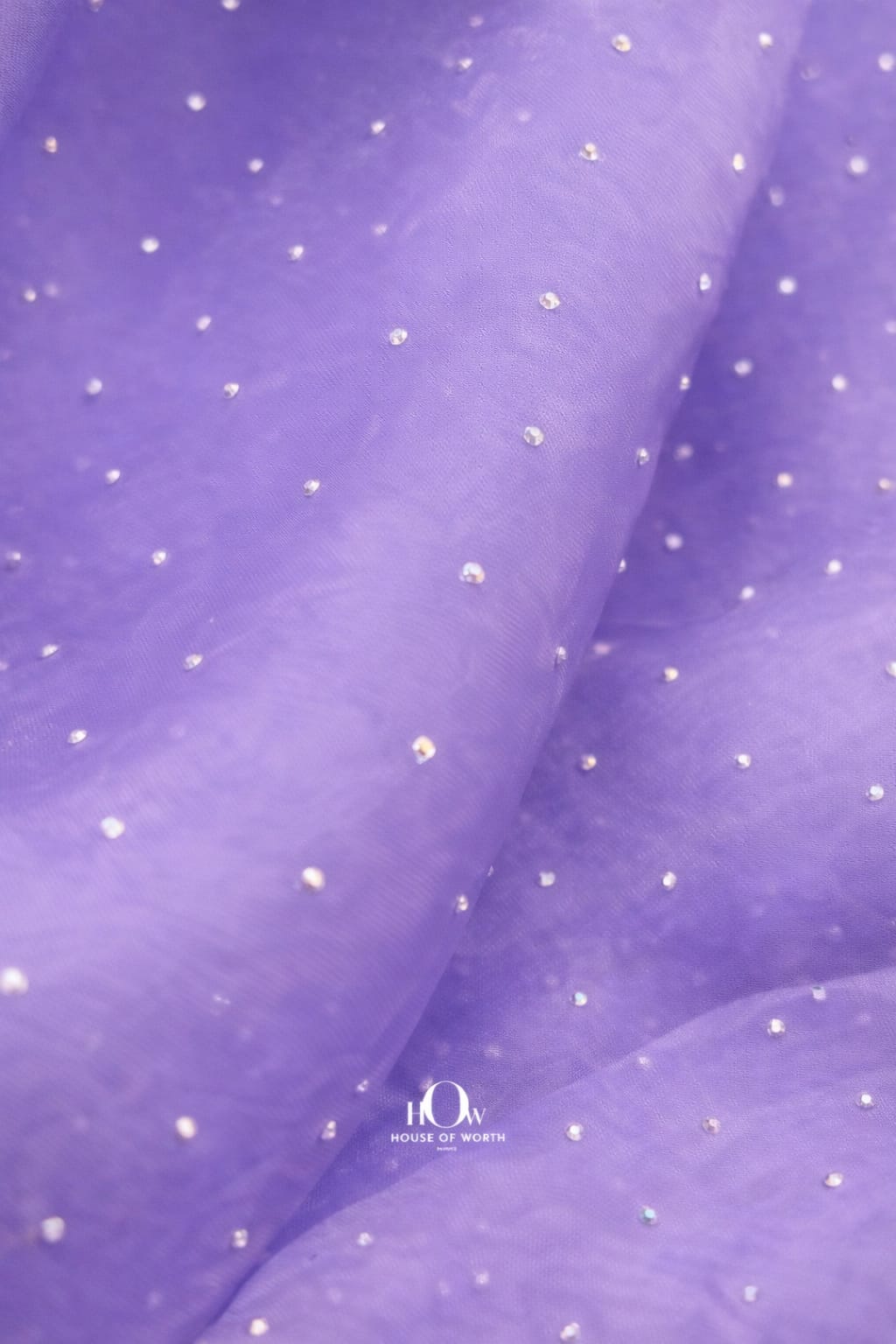 Light purple organza cloth with sparkling embellishments, perfect for bridal gowns