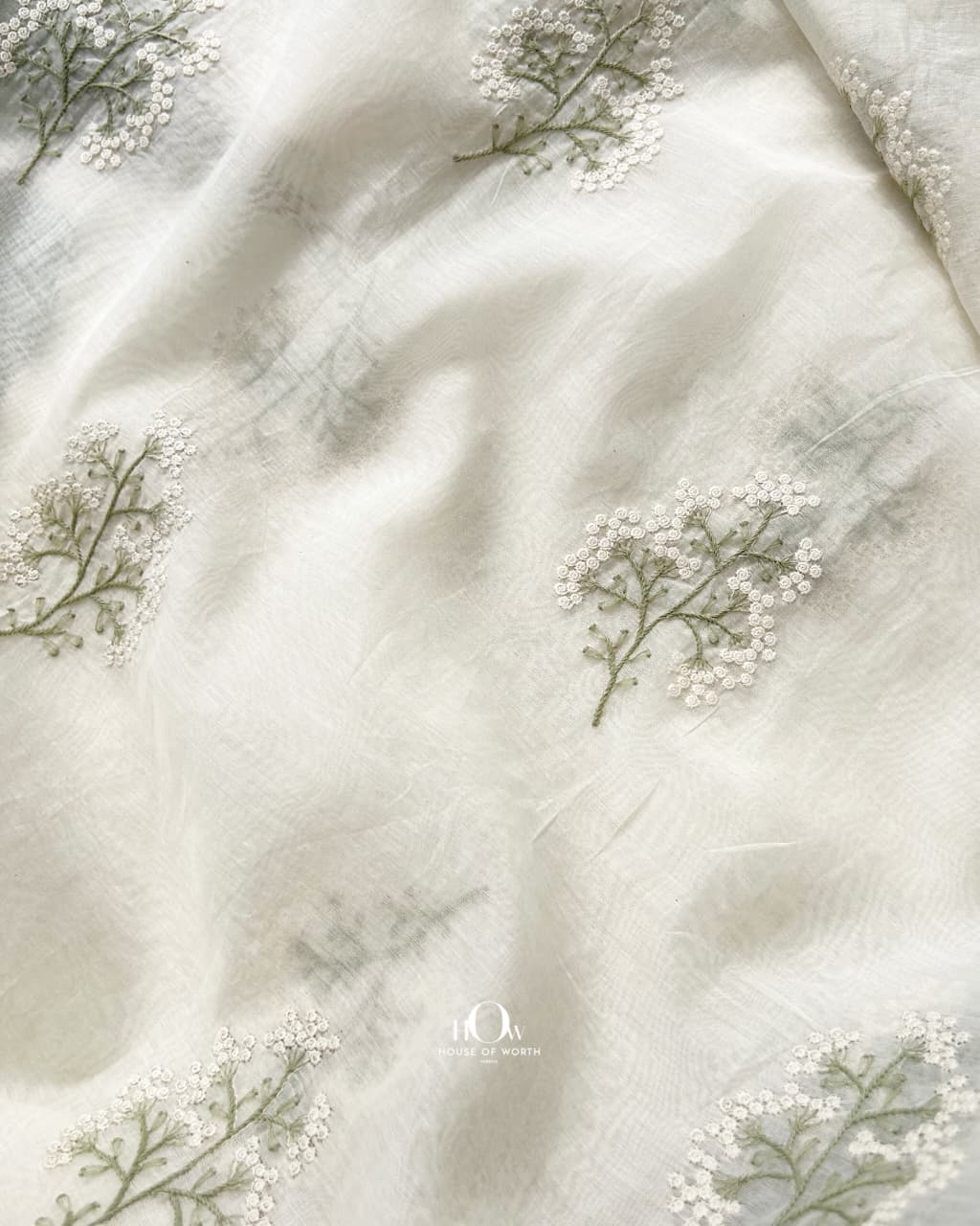 Fine ivory and sage botanical embroidery on Pure Mul Chanderi in close detail