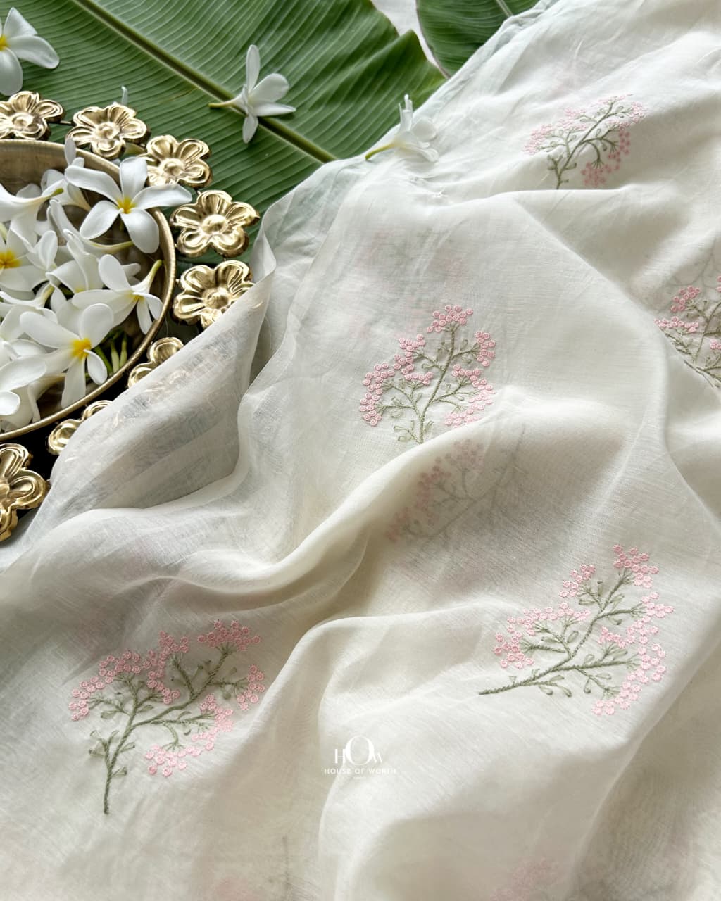 Soft ivory Pure Mul Chanderi with blush pink floral sprigs and sage green stems