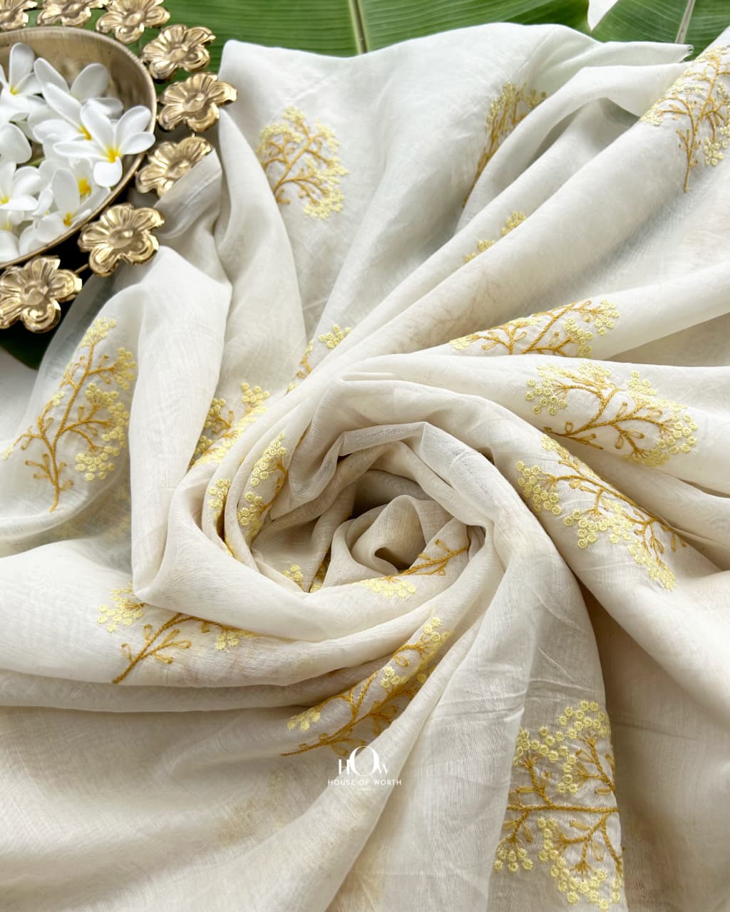 Butter yellow floral sprigs across ivory Pure Mul Chanderi with mustard stems