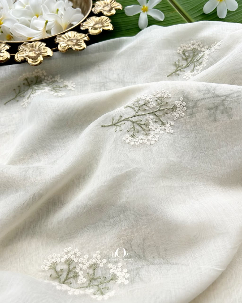 Off white Kasavu Pure Mul Chanderi with ivory floral sprigs and sage green stems