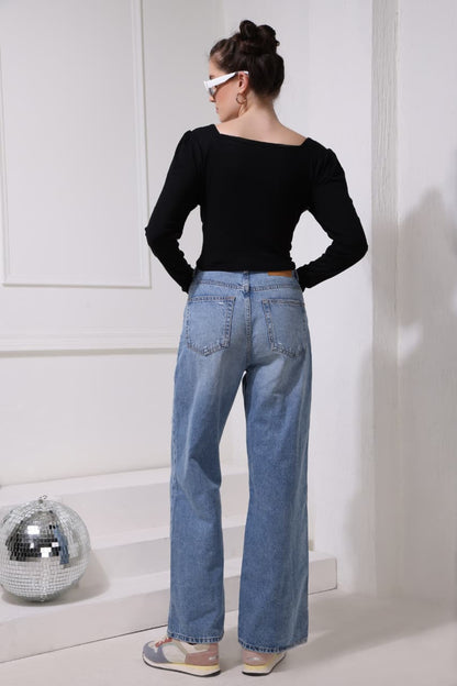 Women’s black casual tee with unique pattern and soft fit, perfect fashion essential