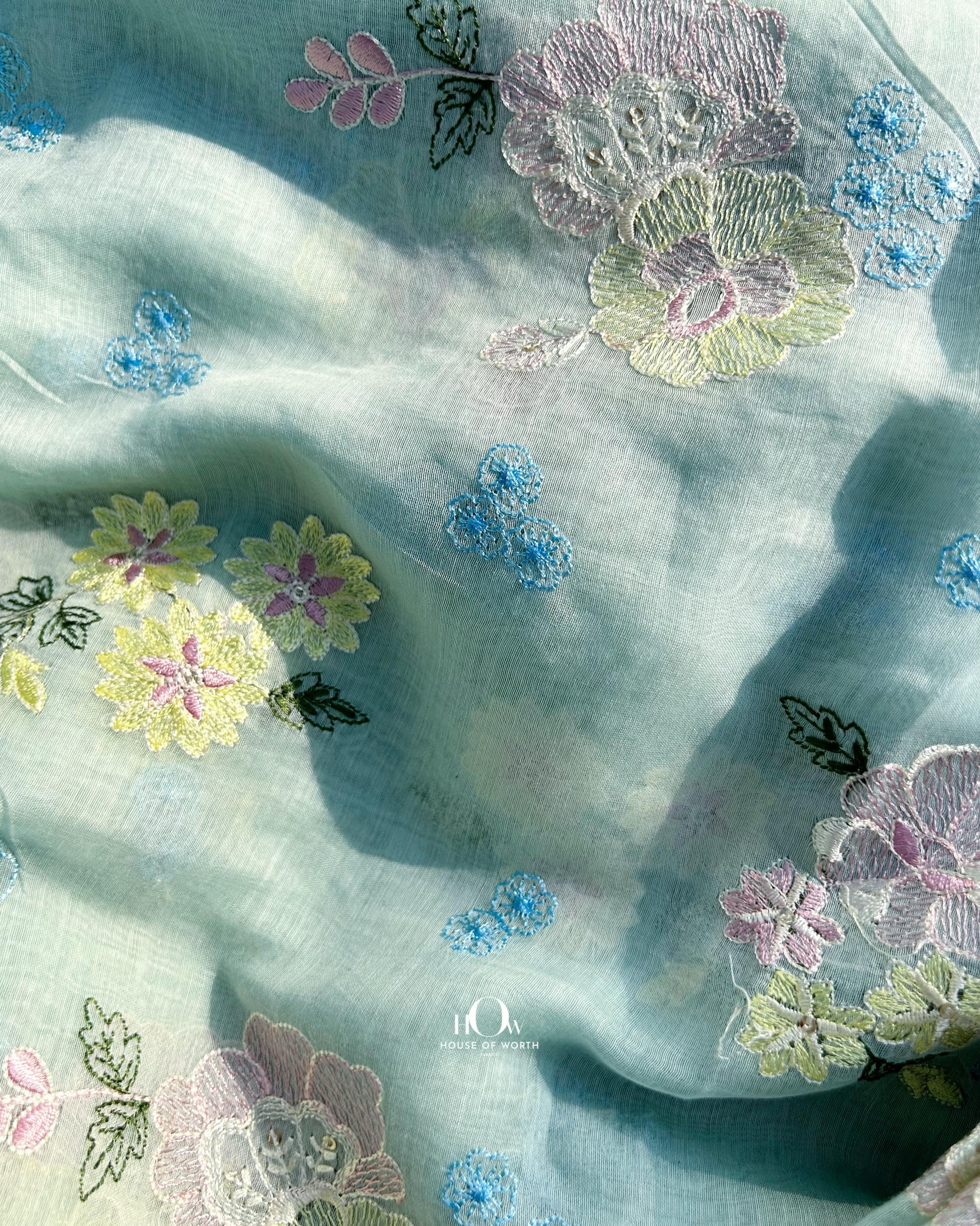 Buy embroidered Mul Chanderi fabric in bulk – floral threadwork fabric for boutiques and ethnic wear brands.