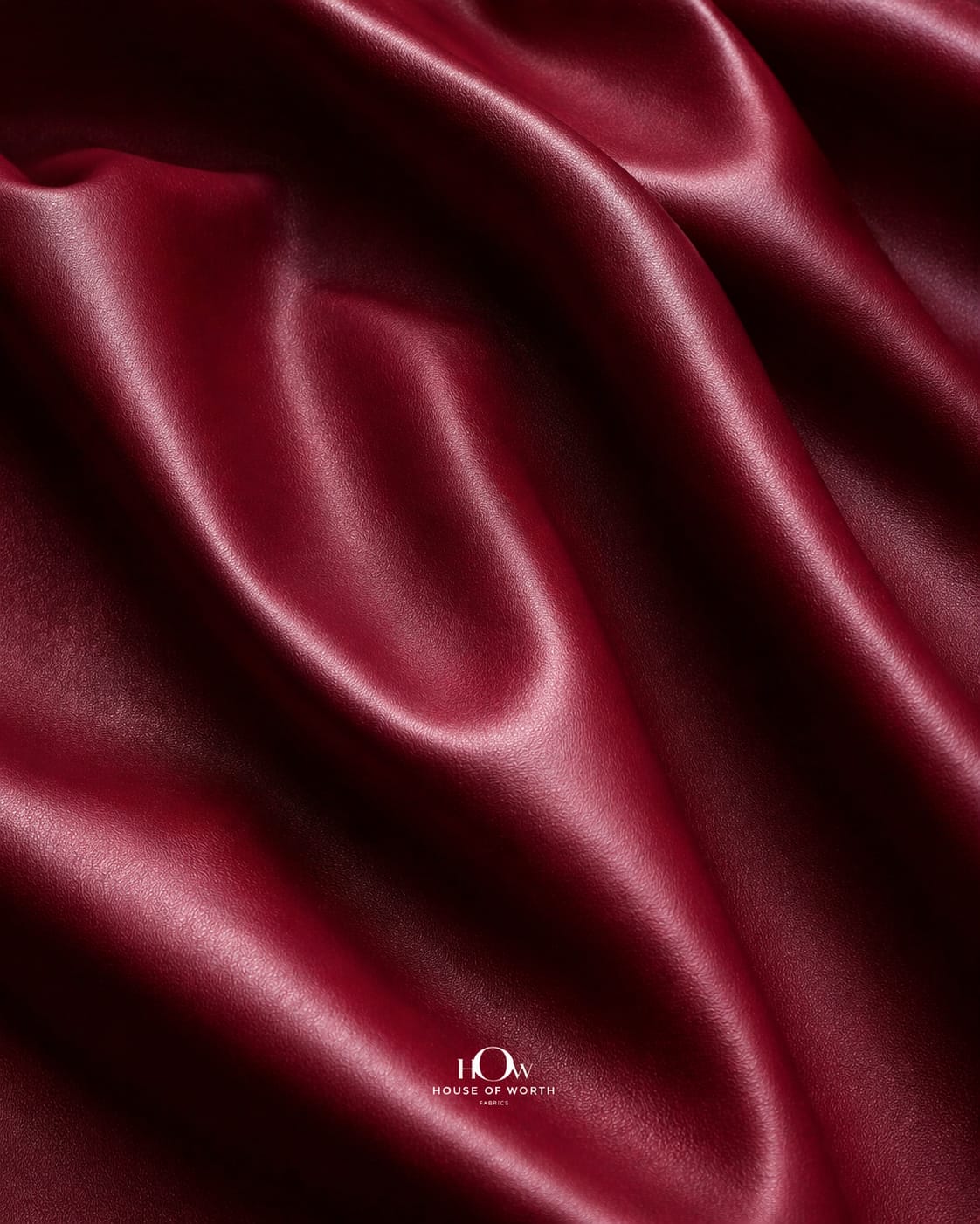 Maroon leather fabric for upholstery on sofas and chairs with flexible, easy-care surface
