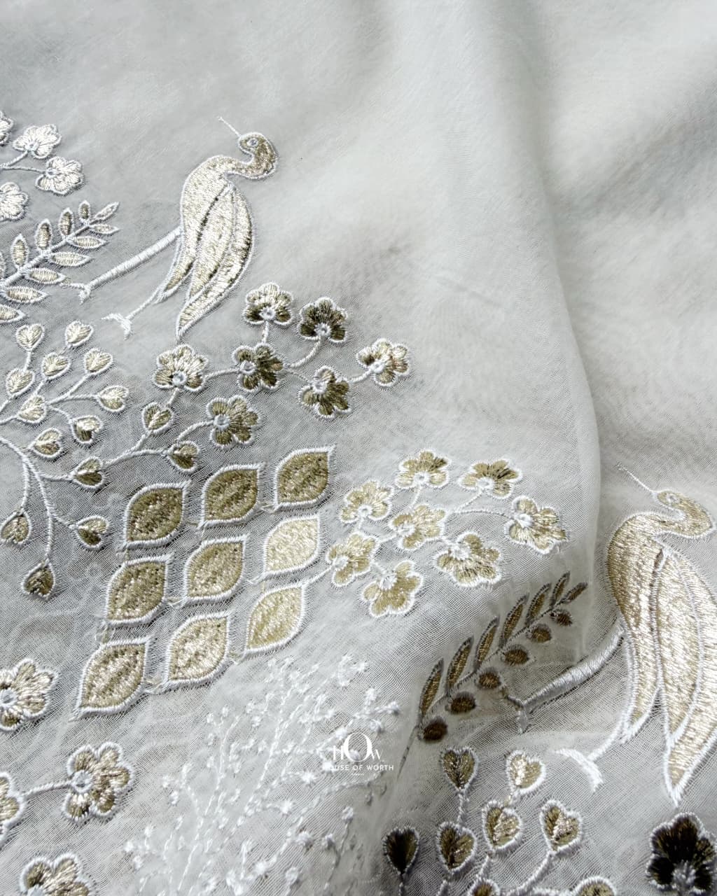 Off-white Pure Mul Chanderi fabric with ivory and muted antique-gold peacock border embroidery