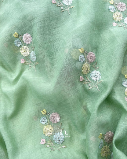 Mint green Pure Mul Chanderi showing with floral motifs