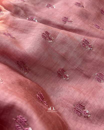 Rust peach Mul Chanderi fabric with subtle butti design – lightweight, breathable, and sourced from top fabric suppliers in Surat and Banaras.