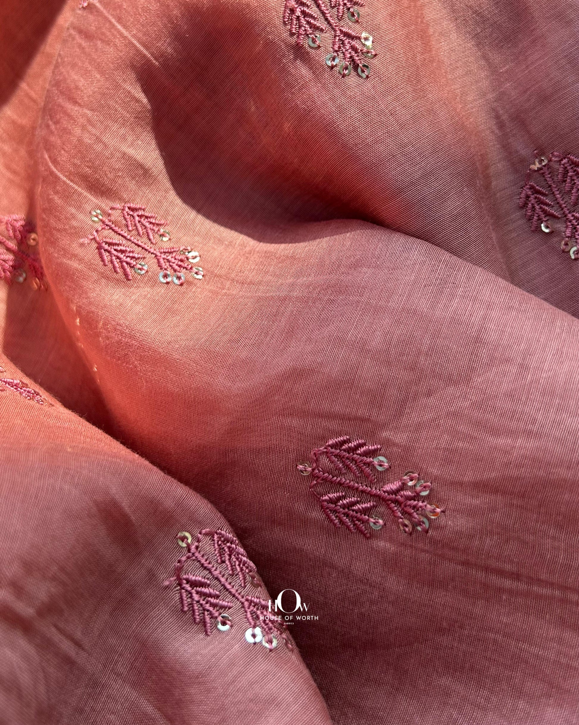 Pure Mul Chanderi fabric with sequin butti embroidery – soft rust-toned fabric ideal for suits, sarees, and festive wear.