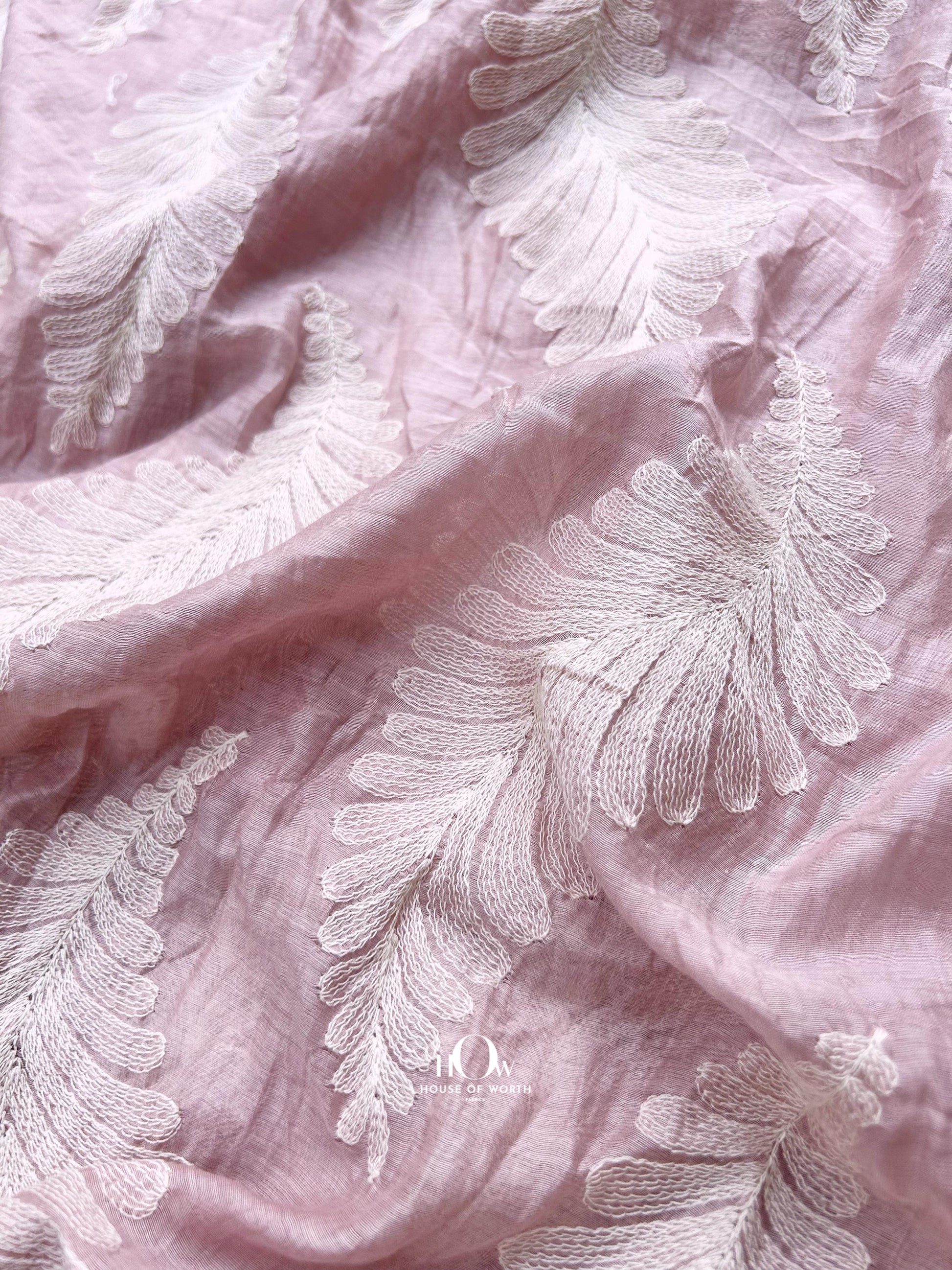 Light pink Pure Mul Chanderi fabric with jacquard leaf motifs – ideal for festive sarees, dupattas, and designer suits.