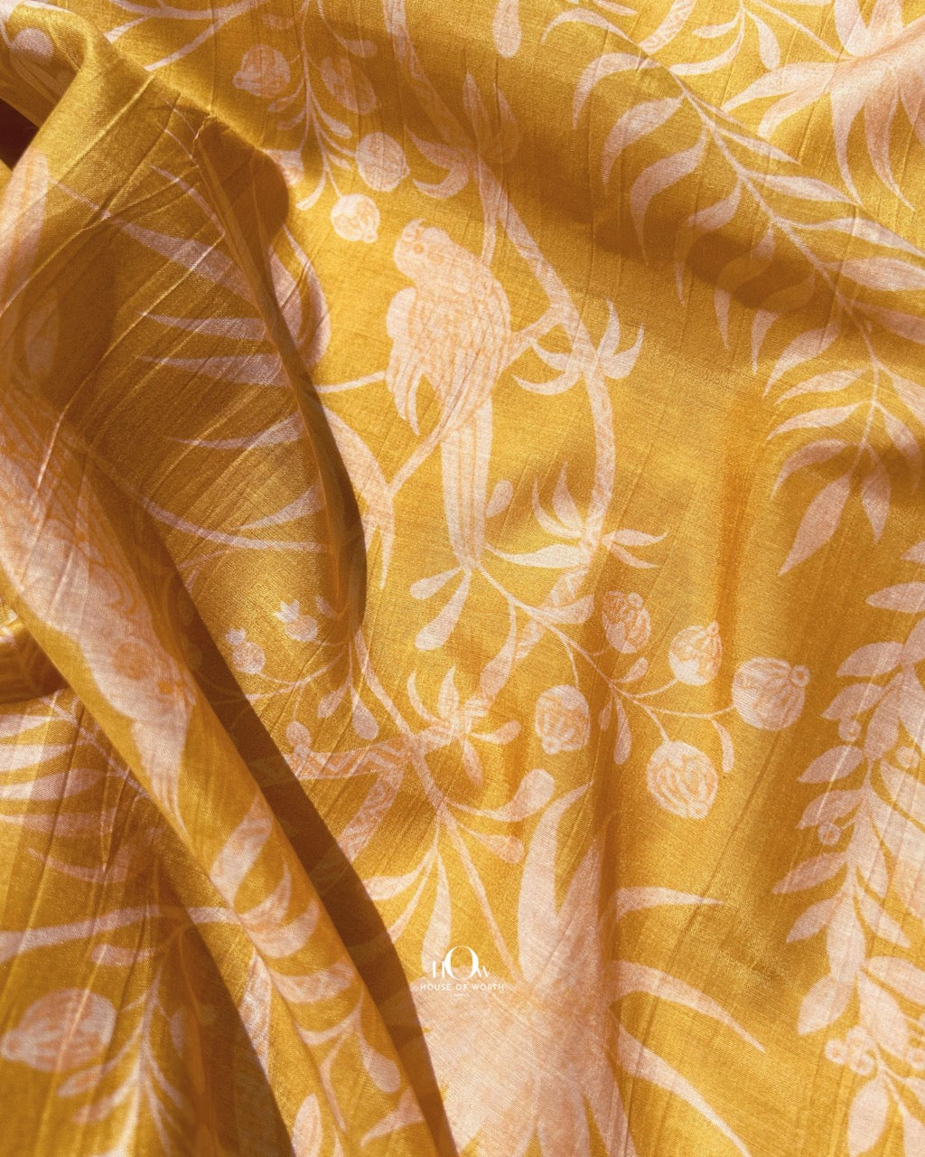 Leaf and nature print Chanderi fabric in yellow – breathable material for elegant ethnic outfits.