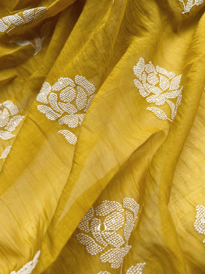 Buy yellow Mul Chanderi fabric with floral thread embroidery – available for retail and wholesale from Delhi and Banaras.