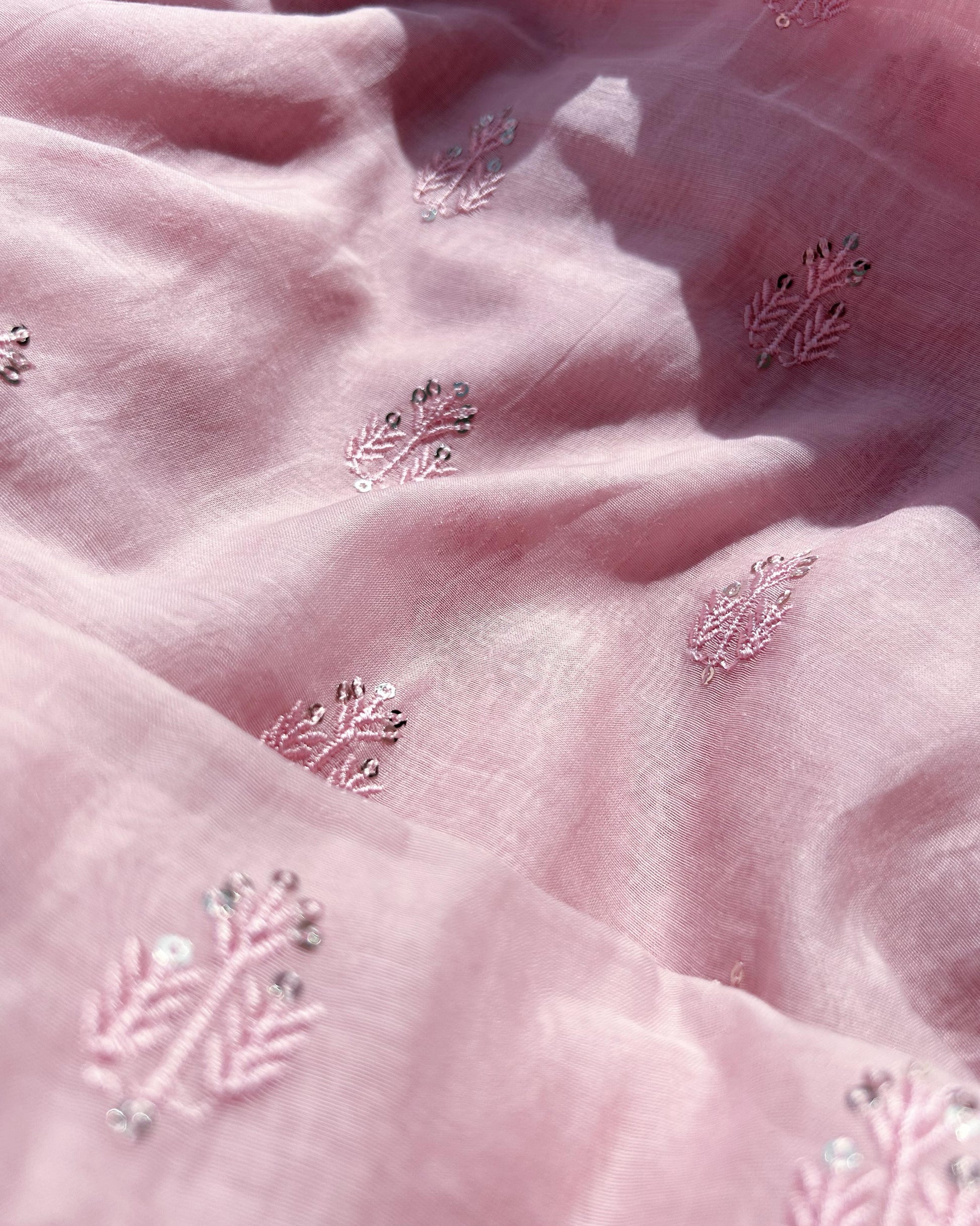Light pink Pure Mul Chanderi fabric with sequin butti embroidery – ideal for sarees, salwar suits, and festive outfits.