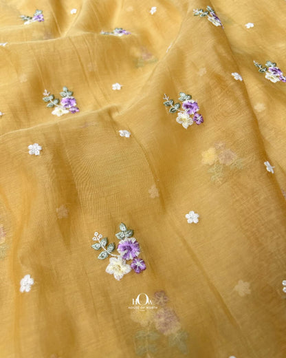mustard yellow chanderi fabric with scattered floral buti embroidery