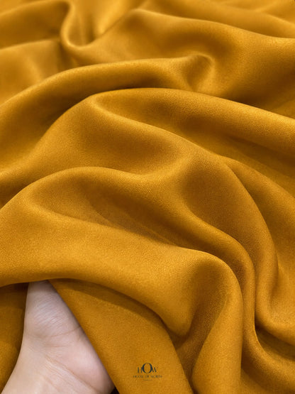 Mustard Yellow Natural Crepe Fabric with elegant flowing drape