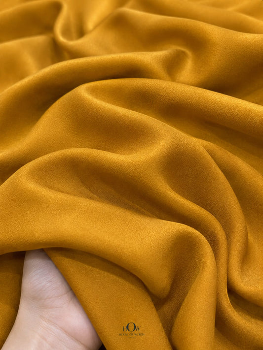 Mustard Yellow Natural Crepe Fabric with elegant flowing drape