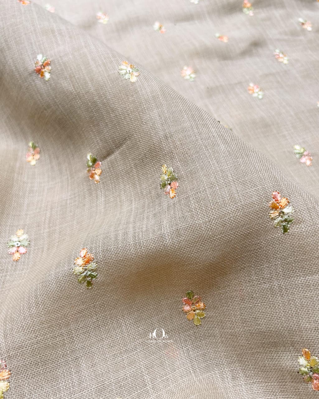 taupe beige floral embroidered linen fabric for premium ethnic and fusion wear.