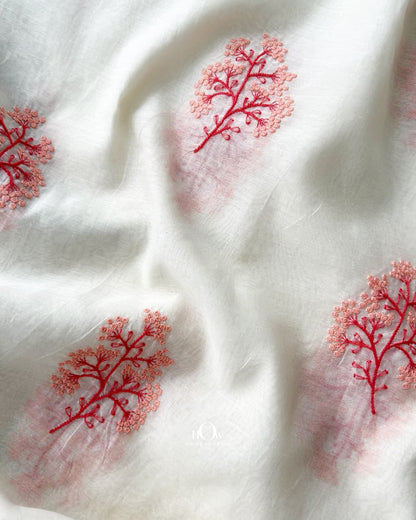 Pure Mul Chanderi fabric showing coral buti motifs over a soft off-white base
