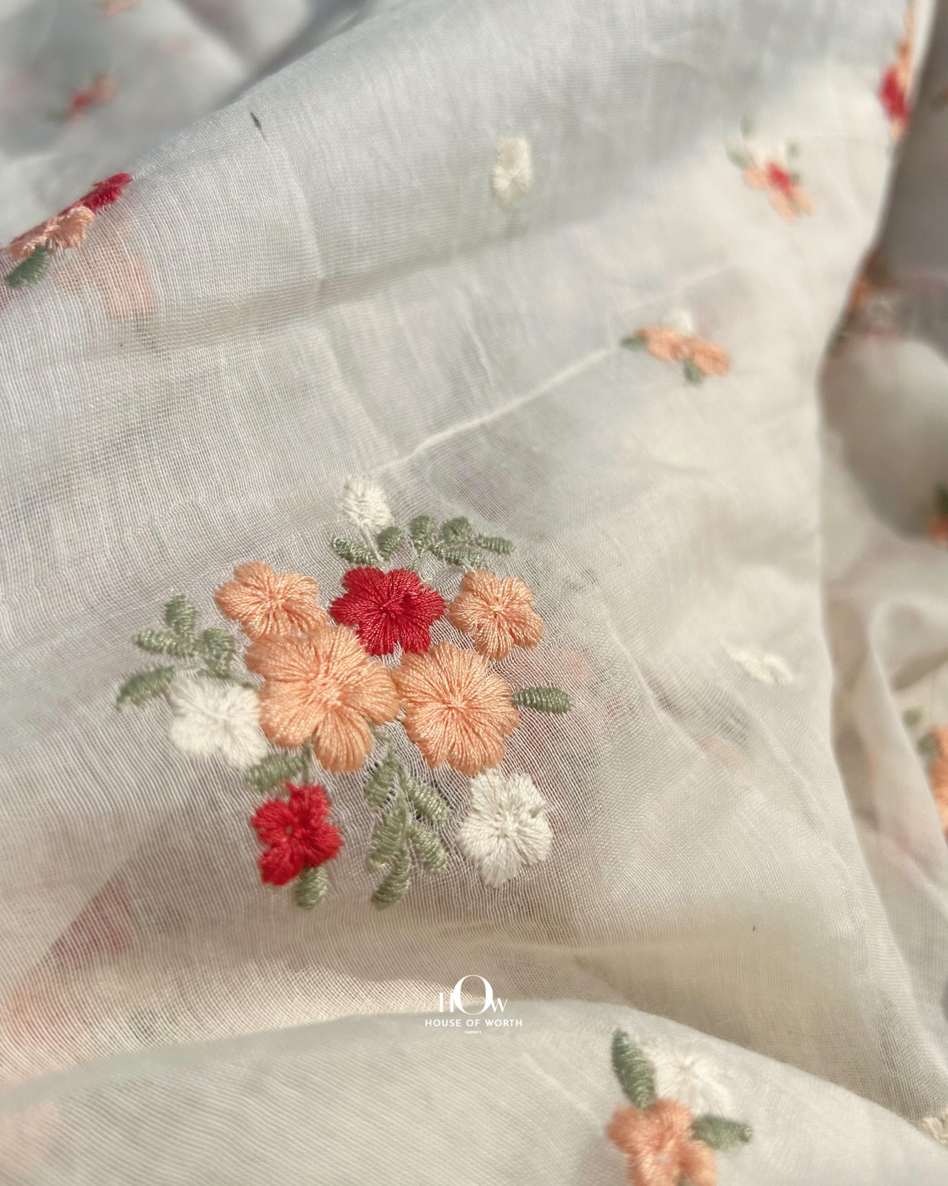 Embroidered Mul Chanderi dress material with red-orange floral motifs – soft, breathable, and perfect for custom dyeing.