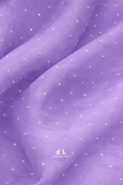 Lilac organza fabric adorned with delicate rhinestones for an elegant look