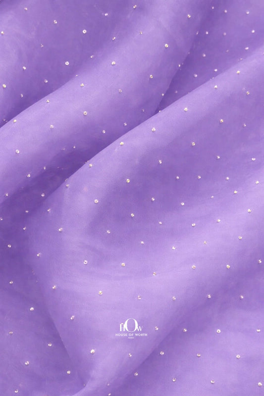 Lilac organza fabric adorned with delicate rhinestones for an elegant look