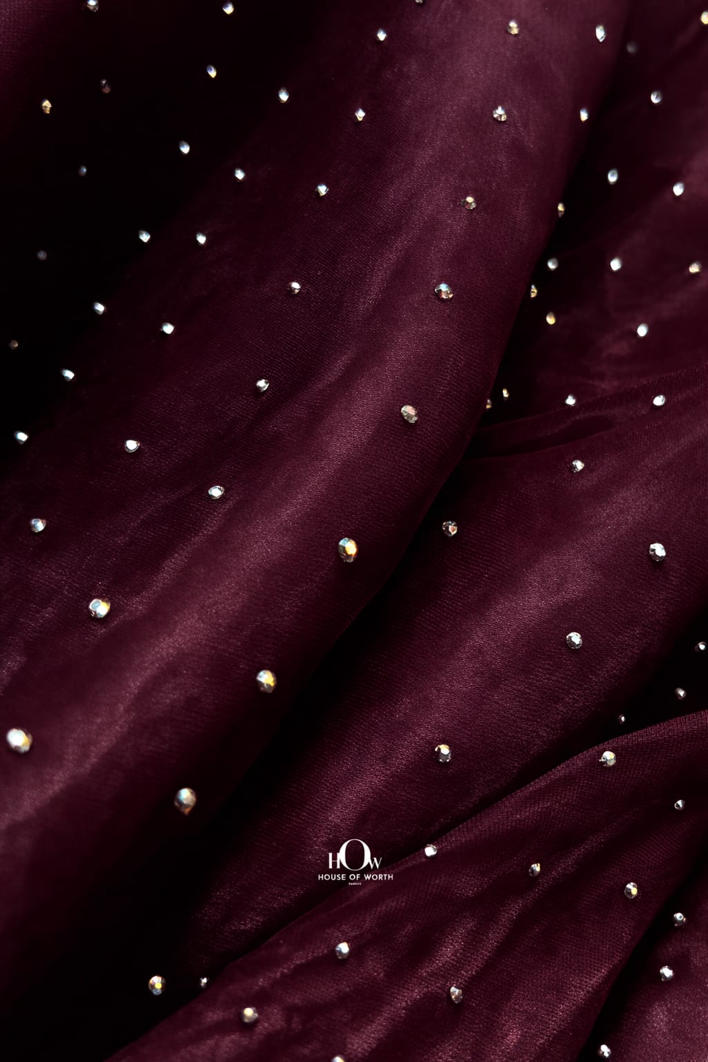 Wine-colored organza fabric with embedded rhinestones, perfect for evening gowns