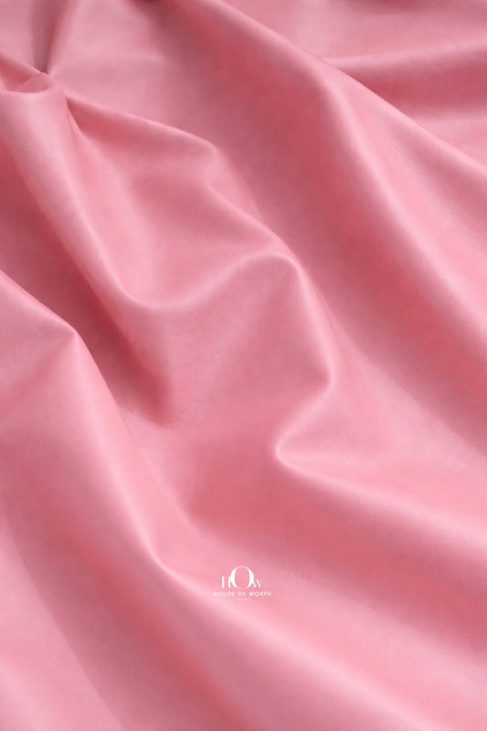  Pink imported leather fabric close-up with polished finish for couture jackets and co-ords