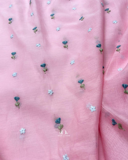 Soft, airy pink Mul Chanderi embroidery fabric adorned with floral motifs—perfect for festive, fusion ensembles