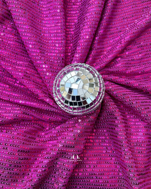 Pink imported sequins fabric for party gowns – available with fabric wholesalers in Delhi.