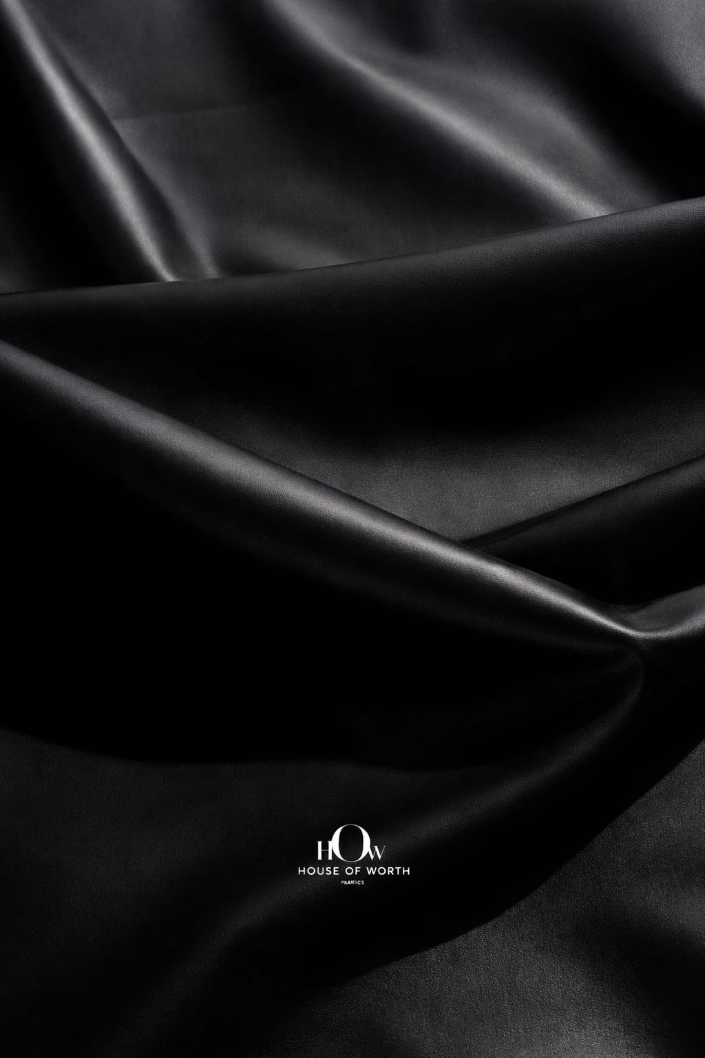 Premium black leather fabric drape showing soft structure for tailoring and designers