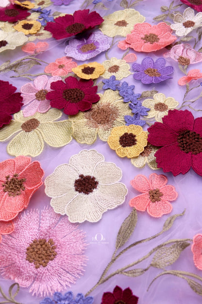 Lilac floral applique fabric in motion, premium floral net for evening wear and boutiques