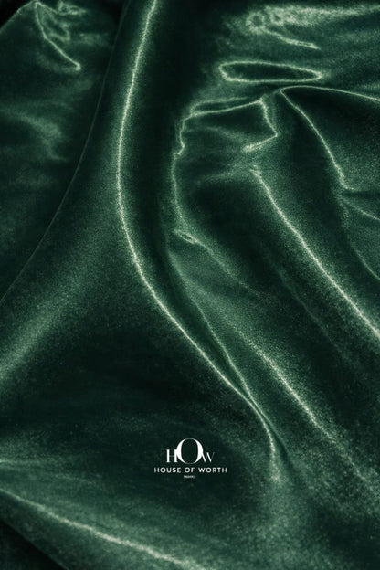 Heavy satin fabric with smooth texture and rich green sheen