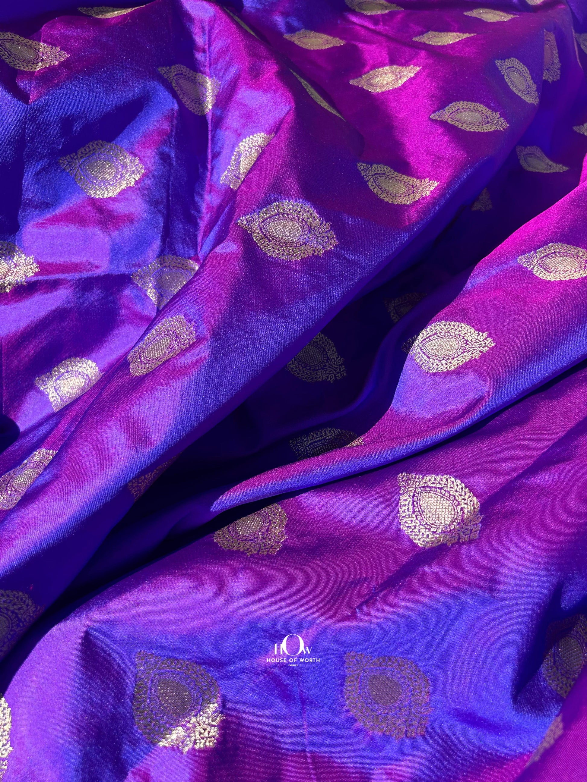 Festive Banarasi silk lehenga from Varanasi in bright red, ideal for weddings & festivals.