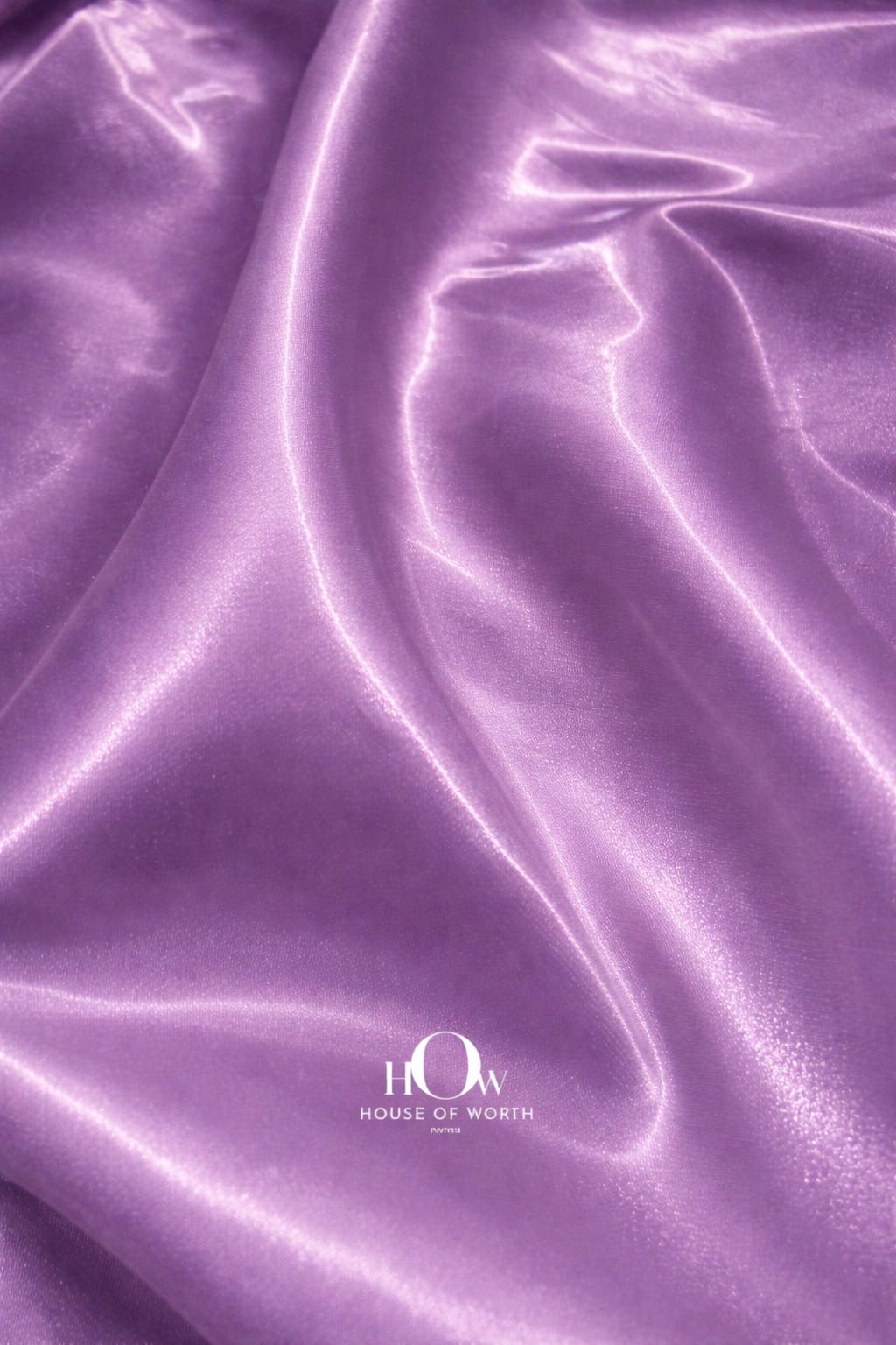 Heavy satin fabric with smooth texture and pastel purple sheen