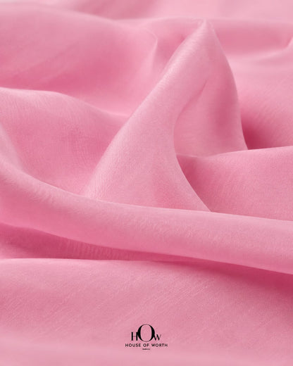 Light pink chanderi fabric close up with soft luxurious texture and breathable weave