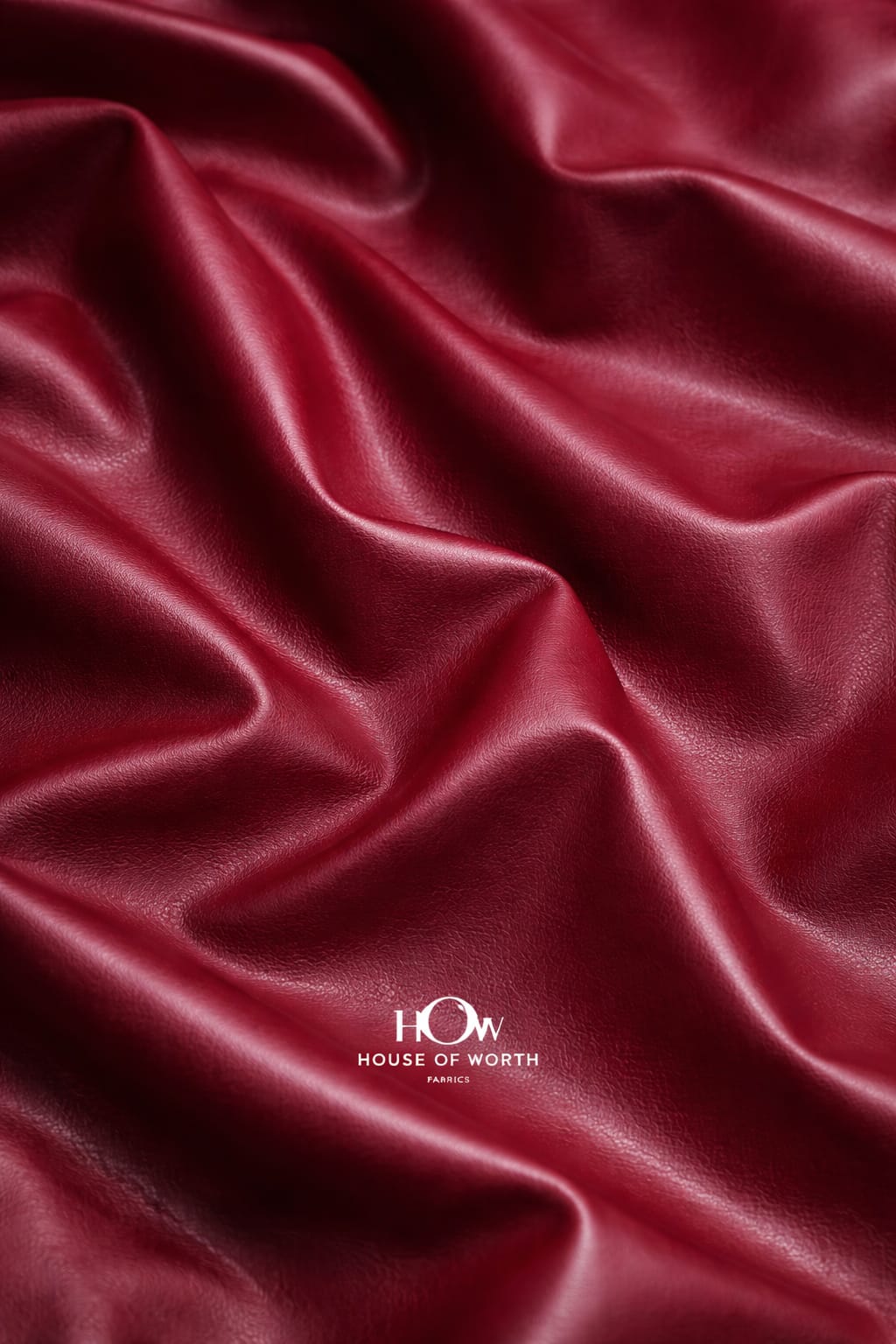 Premium maroon leather fabric drape—structured feel for tailoring and designer cuts