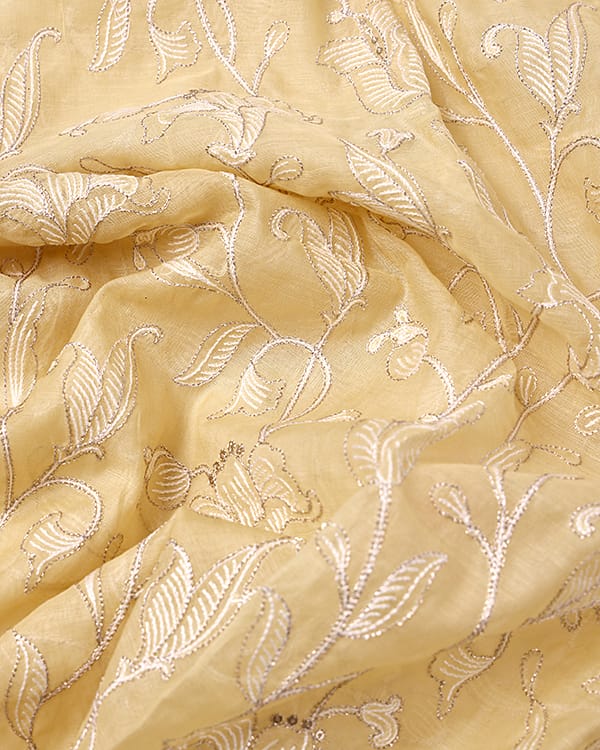 premium mul chanderi fabric featuring detailed embroidery for designer kurta and gown.