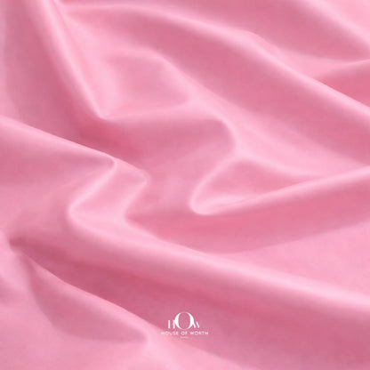 Premium pink leather fabric drape showing soft structure for fashion designers