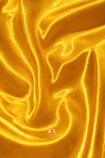 Heavy satin fabric in yellow shade with smooth texture and rich sheen