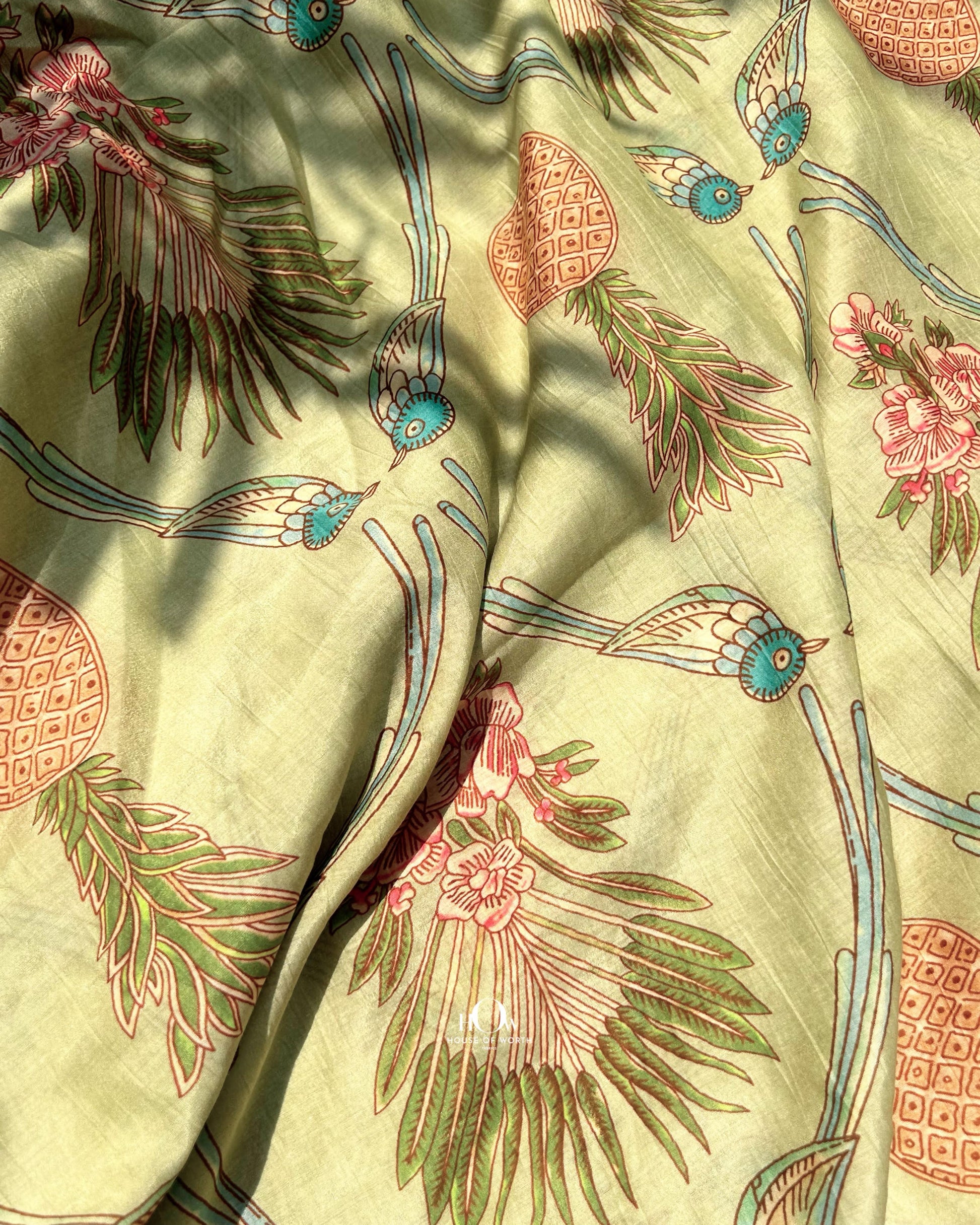 Leaf print Chanderi fabric in pastel green – soft handloom fabric for designer sarees and festive suits.