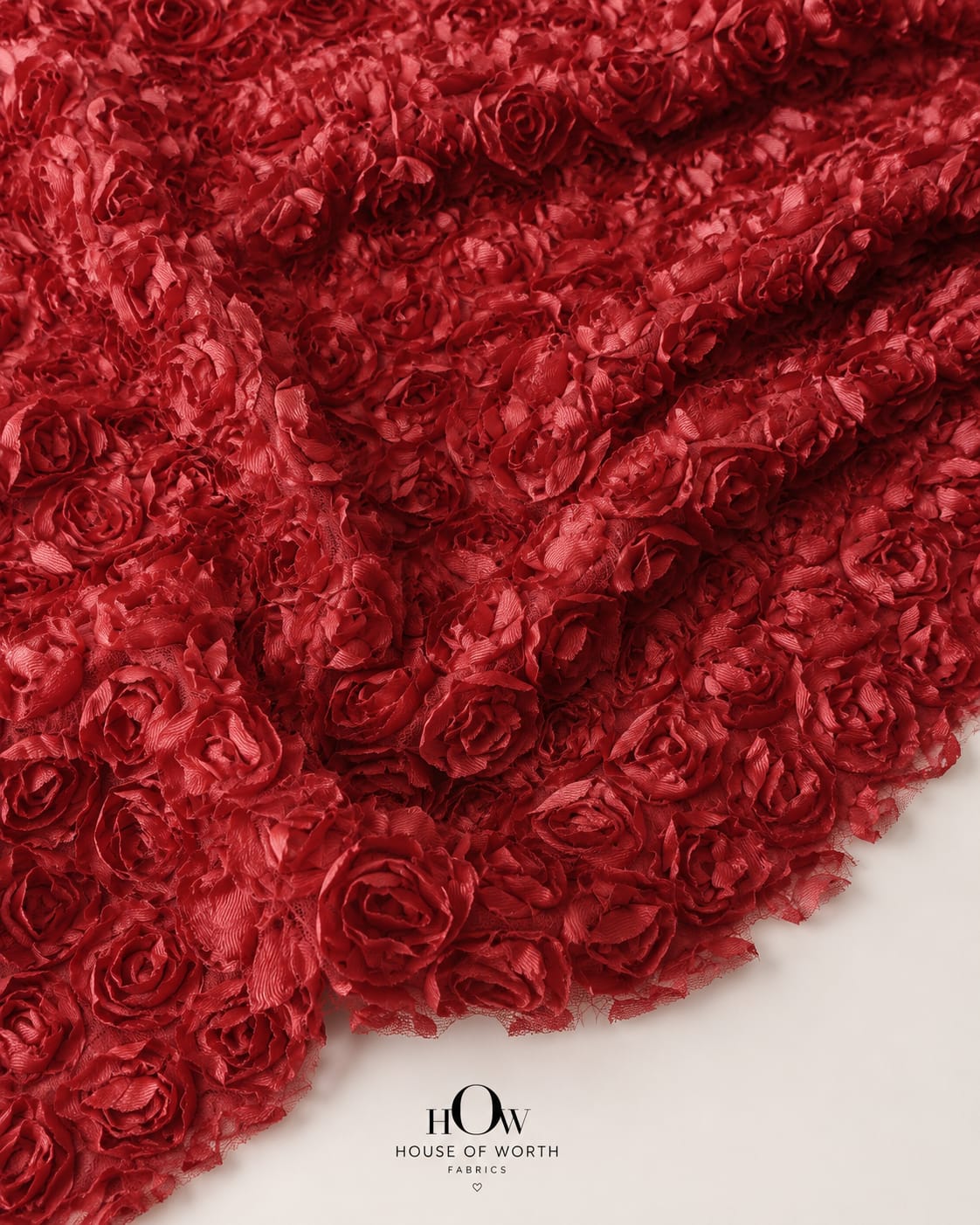 Red 3D floral applique fabric on net with bold raised flowers