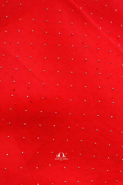 Elegant red organza material adorned with sparkling crystals