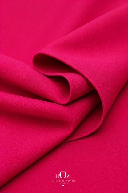 Close-up of hot pink Scuba Sandwich Fabric showing its smooth-looking surface and clean solid finish