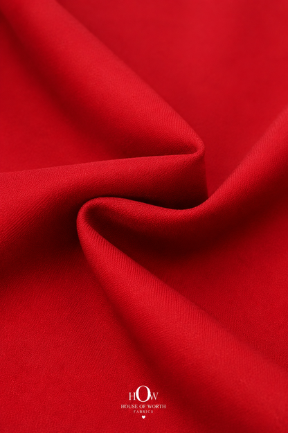 Close-up of red Scuba Sandwich Fabric showing its smooth-looking surface and neat solid finish
