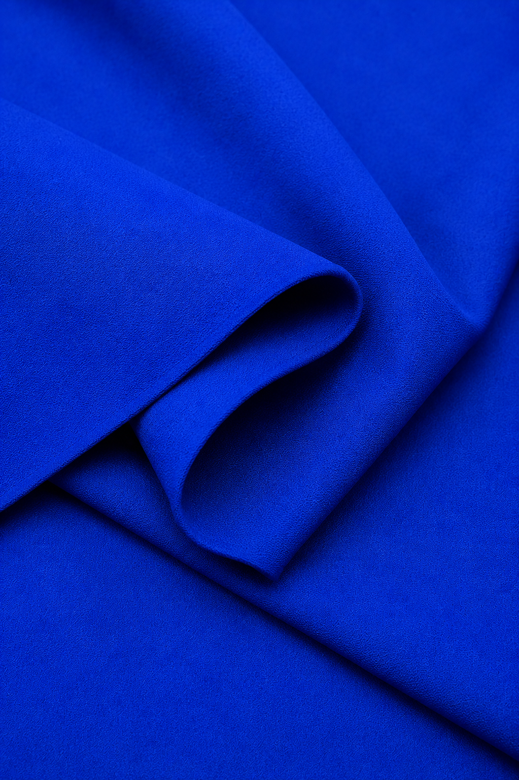 Navy blue Imported Scuba Sandwich Fabric draped to show its structured body and deep solid colour