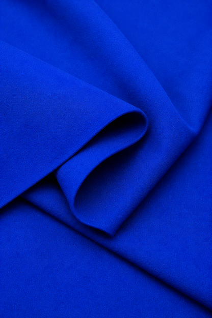 Navy blue Imported Scuba Sandwich Fabric draped to show its structured body and deep solid colour
