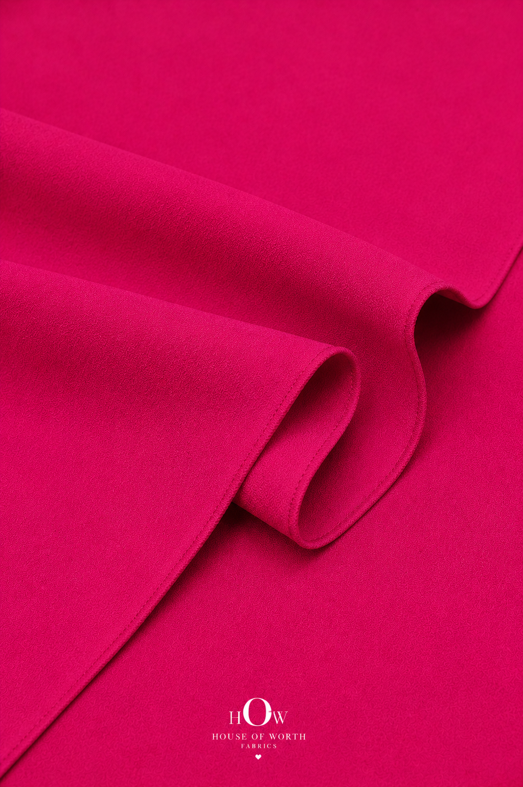 Hot pink Imported Scuba Sandwich Fabric draped to show its structured body and vivid solid colour