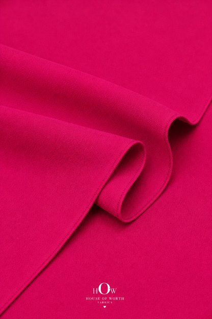 Hot pink Imported Scuba Sandwich Fabric draped to show its structured body and vivid solid colour