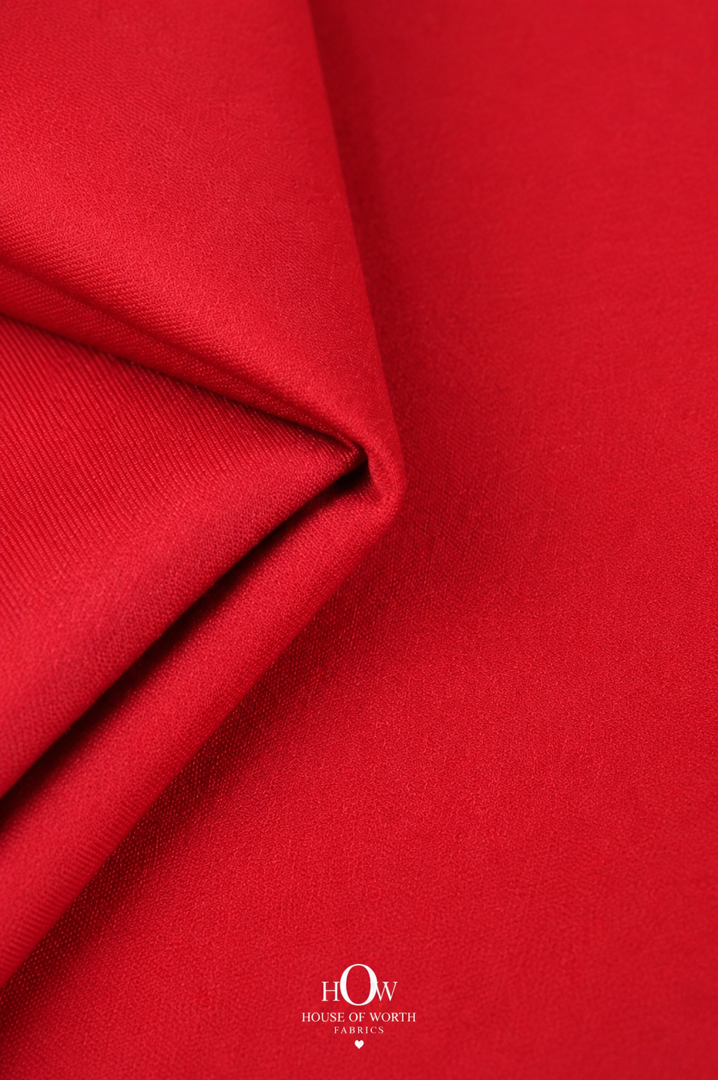 Solid red Imported Scuba Sandwich Fabric with a bold clean colour, smooth-looking surface and structured look