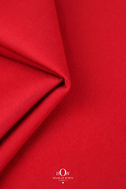 Solid red Imported Scuba Sandwich Fabric with a bold clean colour, smooth-looking surface and structured look